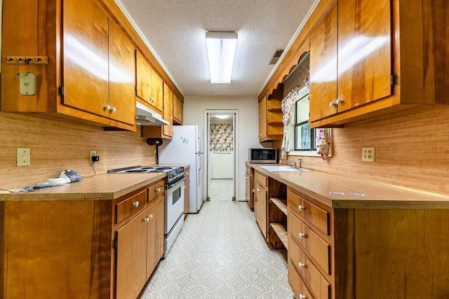 kitchen featuring stainless steel microwave, brown cabinets, open shelves, under cabinet range hood, and electric range oven