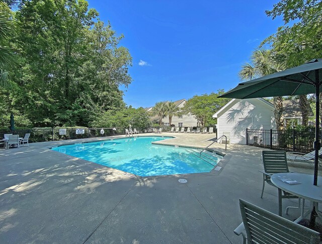 5226 Fernland Way N, Charleston, SC 29420 - pool with a patio area and fence