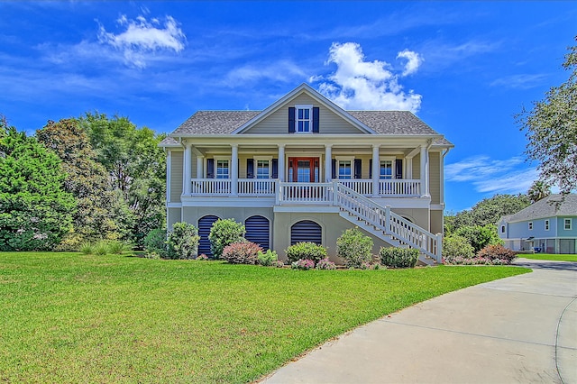 view of front facade featuring covered porch and a front lawn