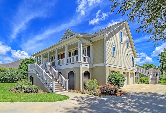 view of front of property with a porch and a garage