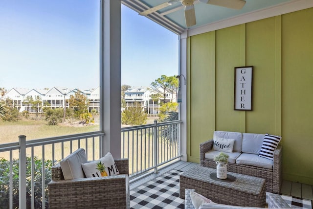 sunroom featuring ceiling fan