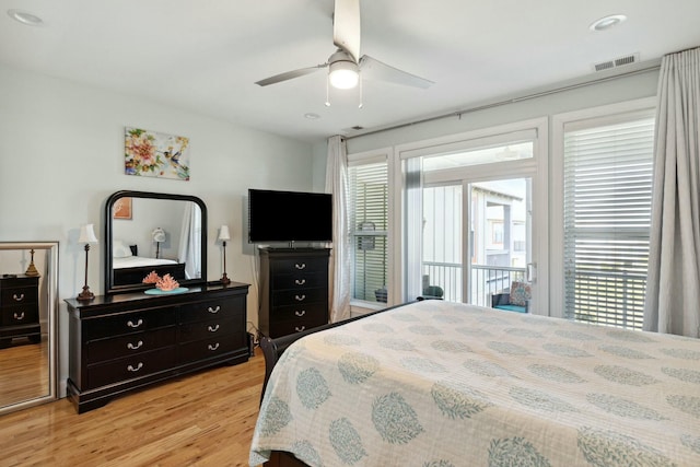 bedroom with light hardwood / wood-style flooring and ceiling fan