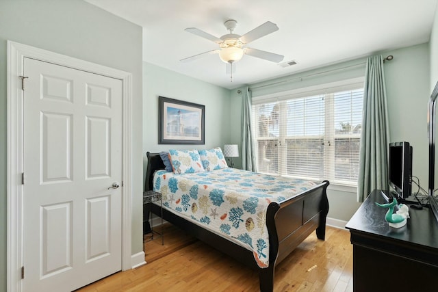 bedroom featuring ceiling fan and light hardwood / wood-style flooring