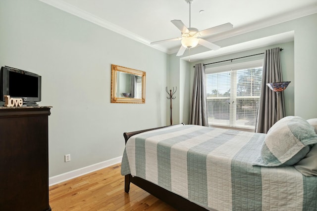 bedroom with ceiling fan, light hardwood / wood-style flooring, and crown molding