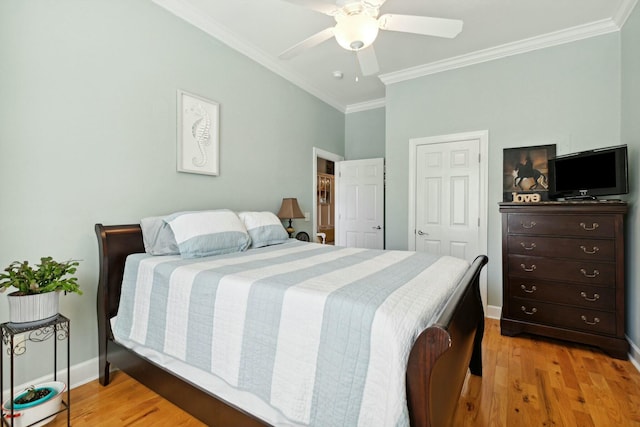 bedroom featuring light wood-type flooring, ceiling fan, and ornamental molding