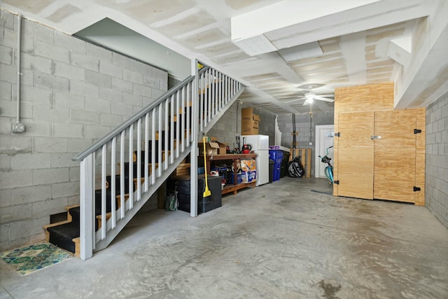 basement with white refrigerator