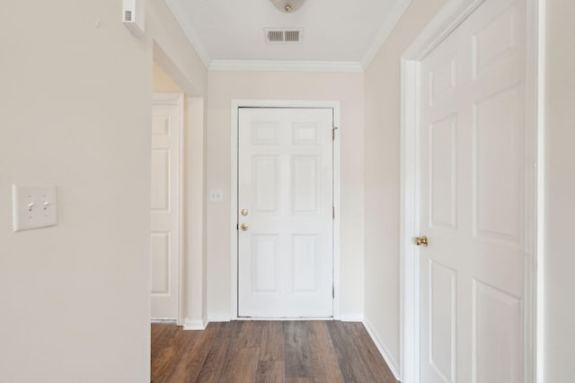 corridor featuring dark hardwood / wood-style flooring and crown molding