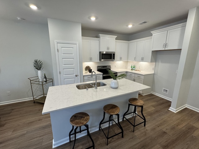 131 Brown Swiss Cir, Summerville, SC 29483 - kitchen with dark wood-style floors, white cabinets, visible vents, stainless steel appliances, and a sink