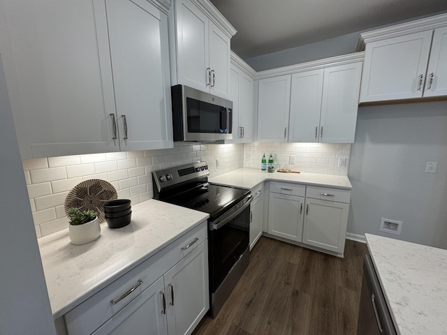 131 Brown Swiss Cir, Summerville, SC 29483 - kitchen with dark wood-style flooring, decorative backsplash, white cabinetry, and stainless steel appliances