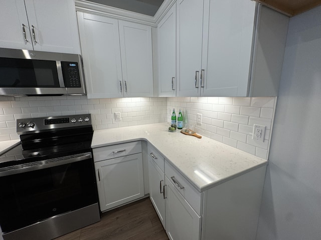131 Brown Swiss Cir, Summerville, SC 29483 - kitchen featuring stainless steel appliances, dark wood-style floors, white cabinetry, and decorative backsplash