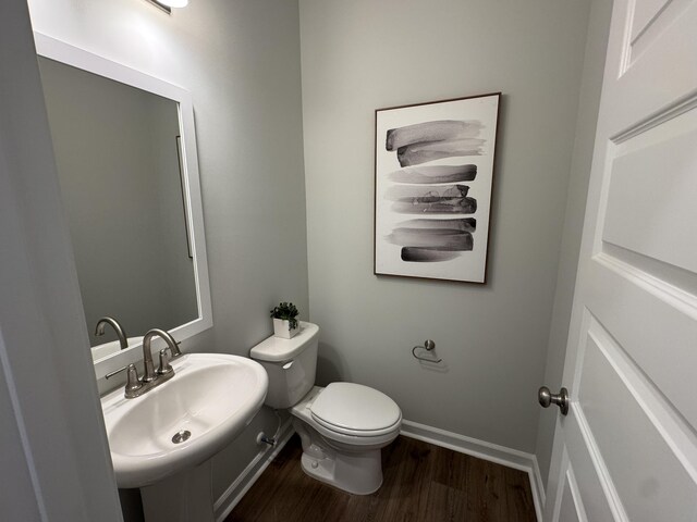 131 Brown Swiss Cir, Summerville, SC 29483 - half bath with a sink, toilet, wood finished floors, and baseboards