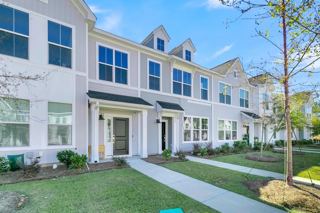 131 Brown Swiss Cir, Summerville, SC 29483 - townhome / multi-family property featuring roof with shingles and a front lawn