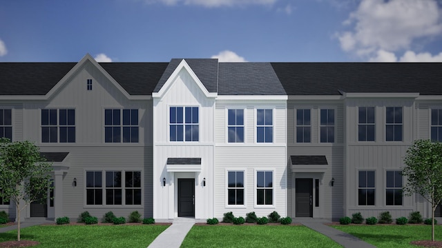 131 Brown Swiss Cir, Summerville, SC 29483 - view of property featuring board and batten siding and a front lawn