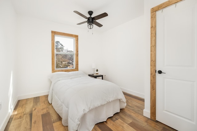 bedroom featuring hardwood / wood-style flooring and ceiling fan