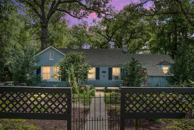 view of front of home with a gate and fence