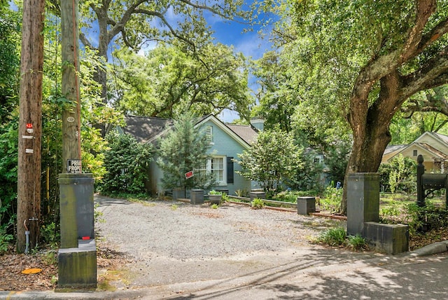 view of property hidden behind natural elements