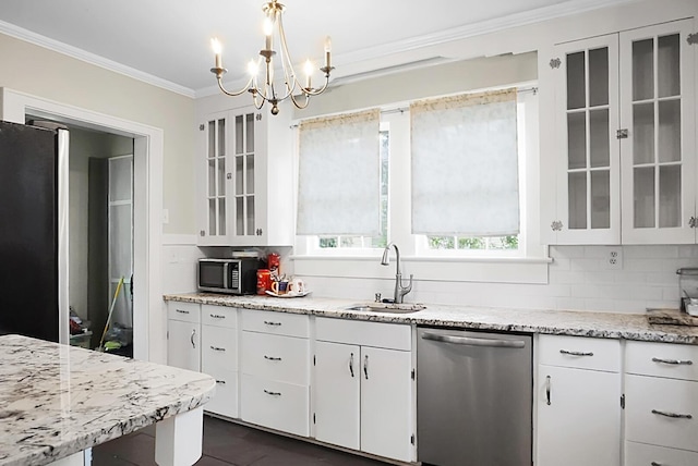 kitchen featuring white cabinetry, stainless steel appliances, crown molding, and a sink