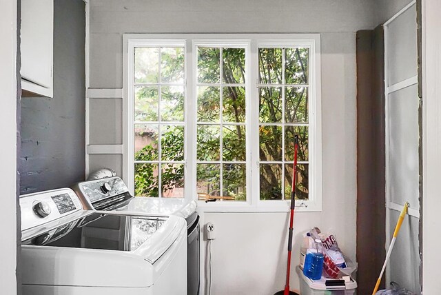 clothes washing area featuring laundry area and washer and dryer