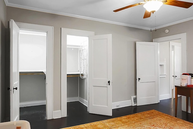 bedroom featuring visible vents, crown molding, dark wood-style flooring, a ceiling fan, and baseboards