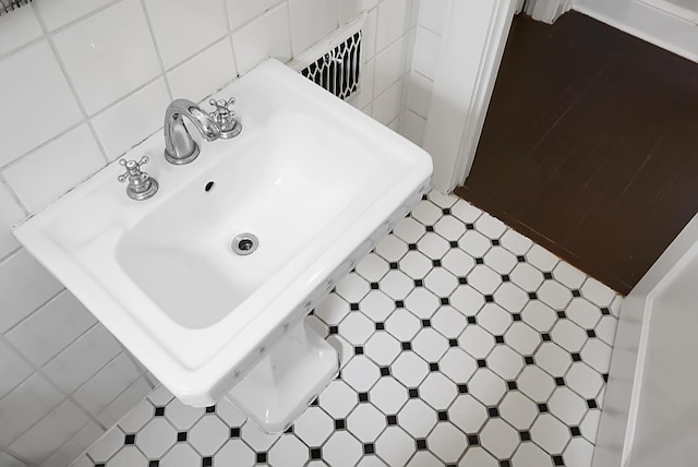 details with tile patterned floors and a sink