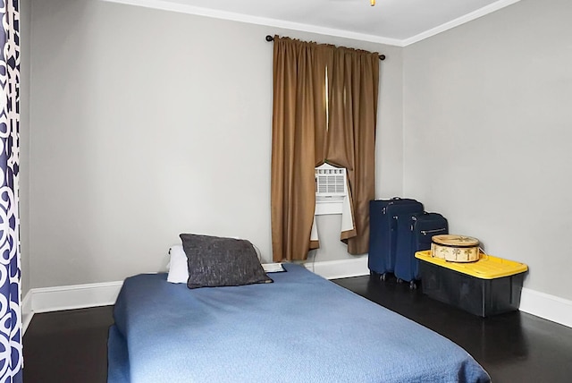 bedroom with baseboards and ornamental molding