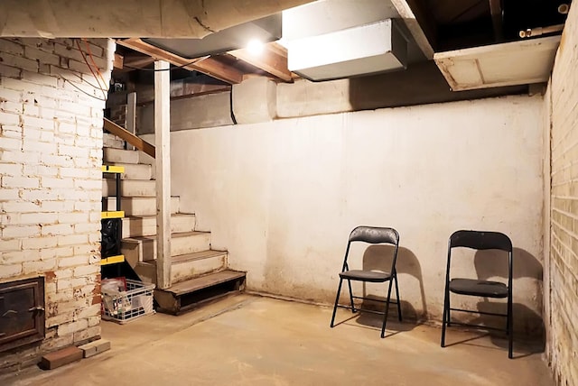 unfinished below grade area featuring stairway