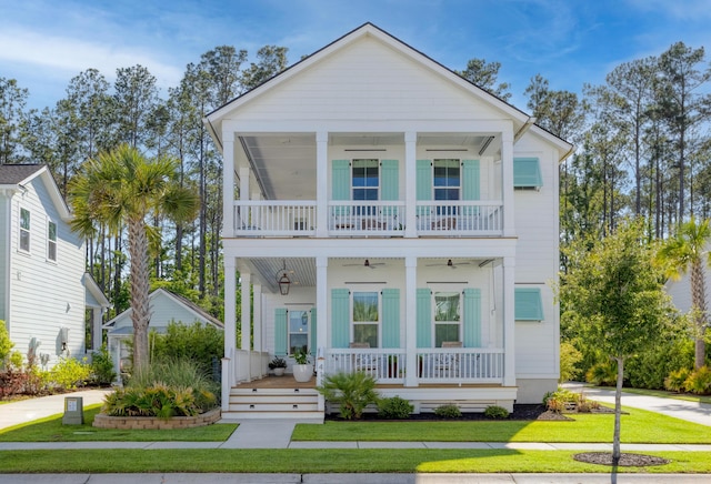 4114 Maidstone Dr, Mount Pleasant, SC 29466 - view of front facade featuring a porch, a ceiling fan, a balcony, and a front lawn