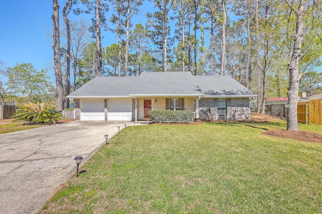 ranch-style home with driveway, a front lawn, fence, and an attached garage