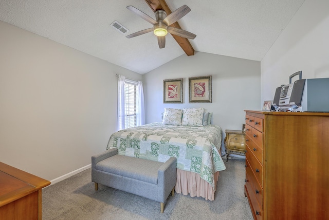 carpeted bedroom with vaulted ceiling with beams, visible vents, ceiling fan, and baseboards