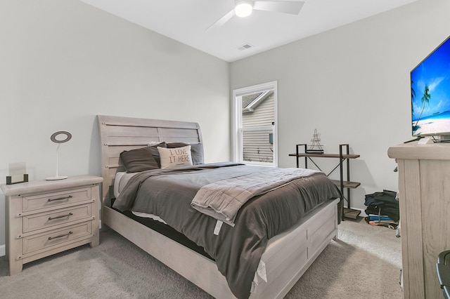 bedroom with ceiling fan and light carpet