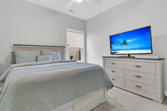 bedroom with ceiling fan and light carpet