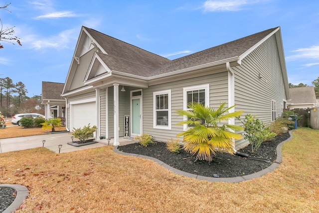 view of front facade featuring a garage and a front yard