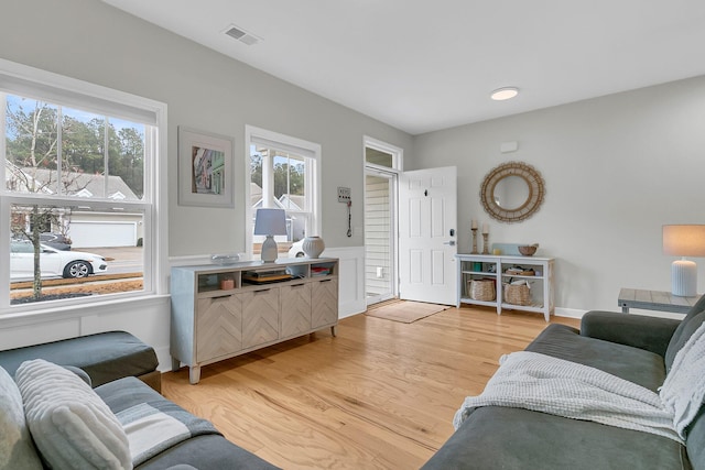 living room with light hardwood / wood-style flooring