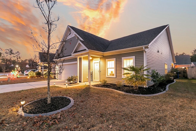 view of front of house with a lawn and a garage