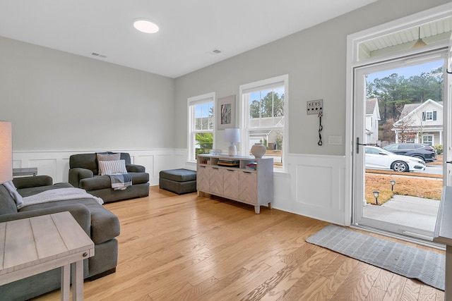 living room with light hardwood / wood-style flooring