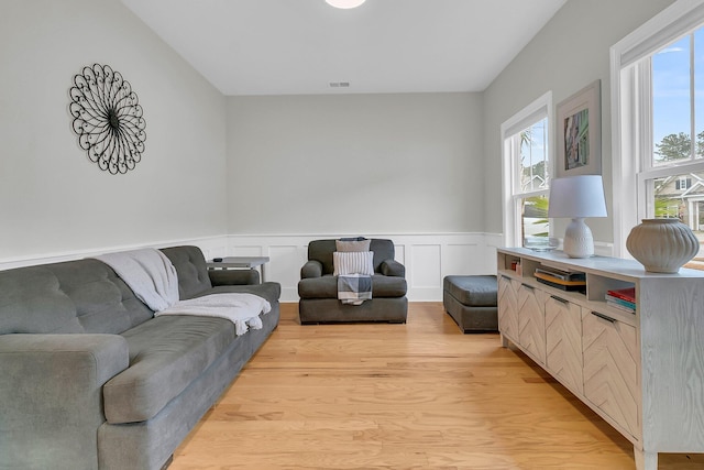 living room with light hardwood / wood-style floors