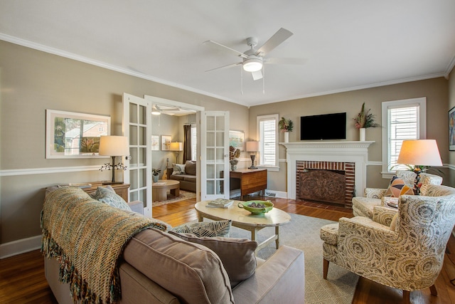 living room with a wealth of natural light, french doors, crown molding, and wood finished floors