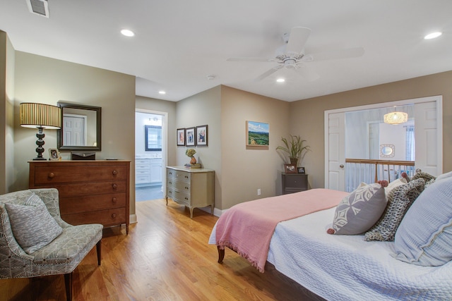 bedroom featuring light wood-style flooring, visible vents, baseboards, and recessed lighting