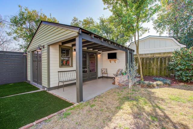 view of outbuilding with fence