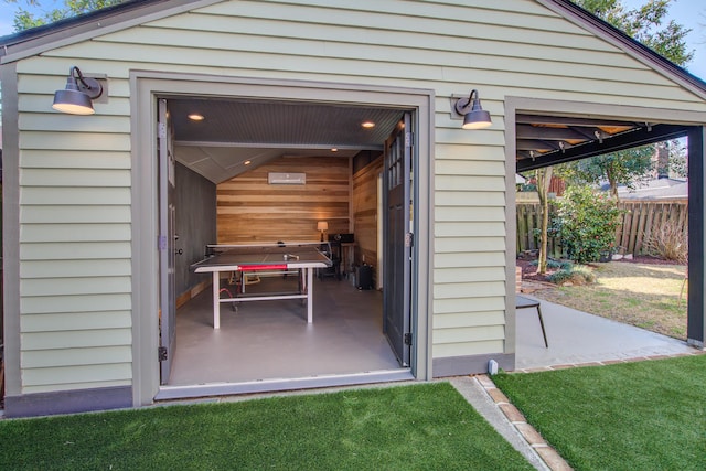 exterior space with an outbuilding and fence