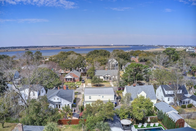 drone / aerial view featuring a water view and a residential view