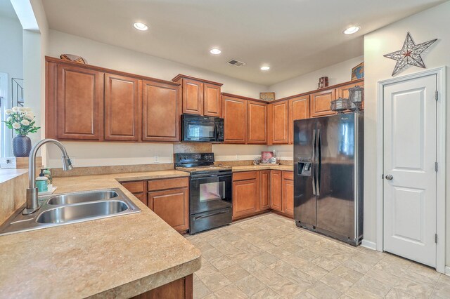 343 Iveson Rd, Summerville, SC 29486 - kitchen featuring a sink, light countertops, black appliances, and brown cabinets