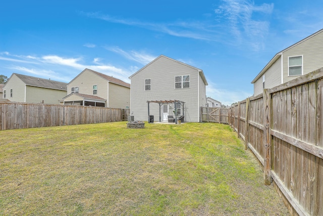 343 Iveson Rd, Summerville, SC 29486 - rear view of property featuring an outdoor fire pit, a fenced backyard, a pergola, and a yard