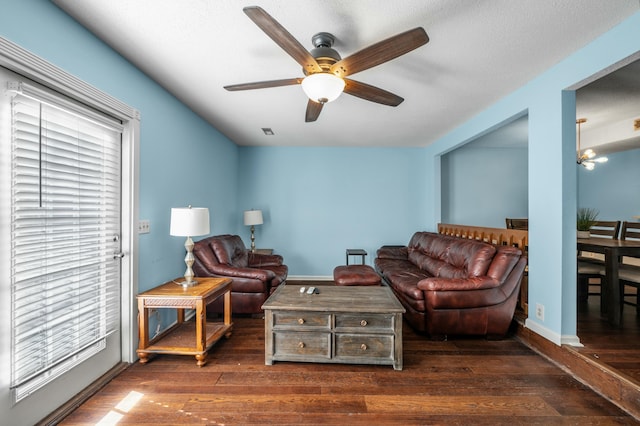 1101 Reserve Way, Summerville, SC 29485 - living room with ceiling fan with notable chandelier and dark hardwood / wood-style flooring