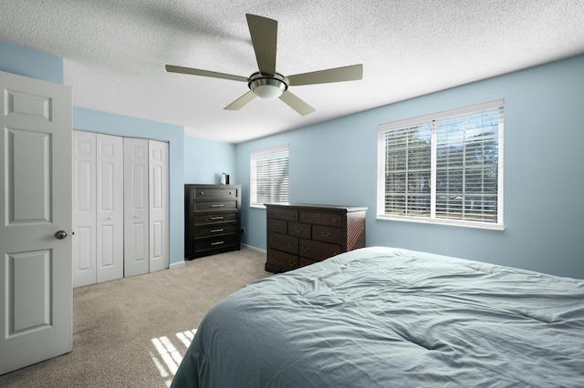 1101 Reserve Way, Summerville, SC 29485 - bedroom with light carpet, ceiling fan, a closet, and a textured ceiling