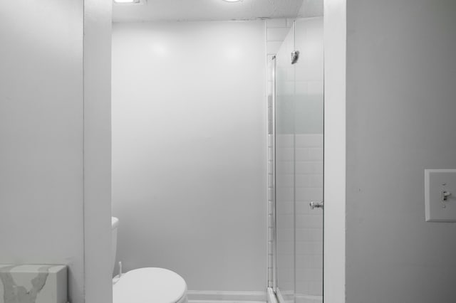 1101 Reserve Way, Summerville, SC 29485 - bathroom with a textured ceiling, toilet, and a shower with door