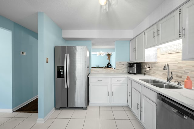1101 Reserve Way, Summerville, SC 29485 - kitchen featuring appliances with stainless steel finishes, white cabinetry, tasteful backsplash, and sink