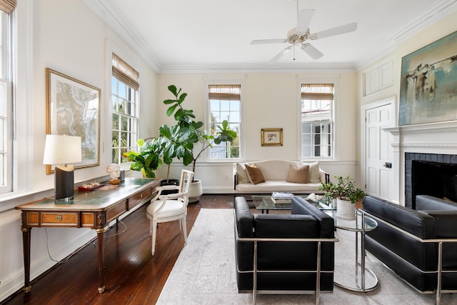 interior space featuring plenty of natural light, a brick fireplace, and ceiling fan