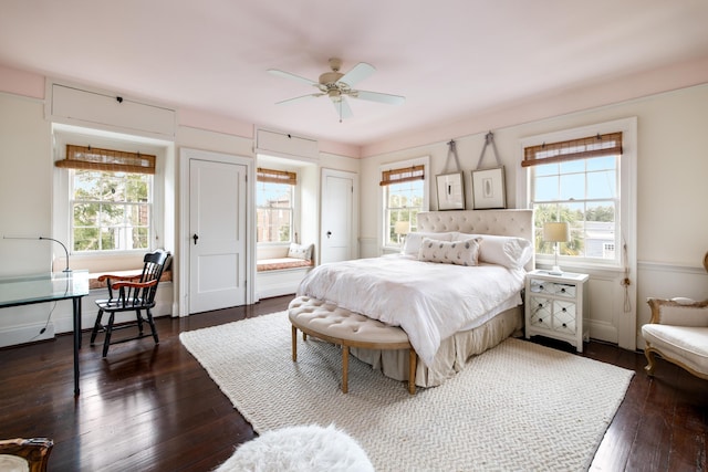 bedroom with ceiling fan and dark wood-type flooring