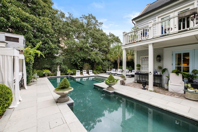 view of swimming pool with a patio